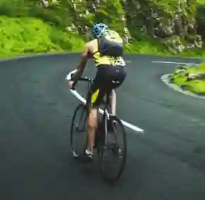 Person riding a bicycle on the road.