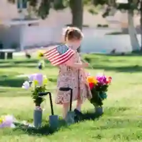 A little girl mourning at a grave, representing the emotional impact of wrongful death cases.