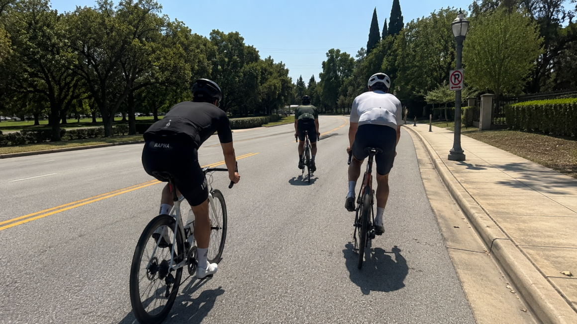three bicycles riding on a road